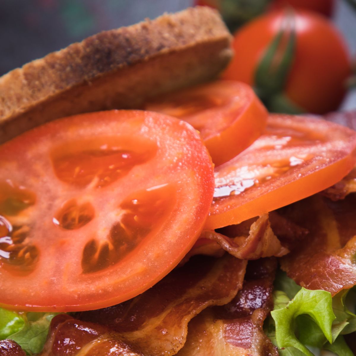 This is a closeup the tomatoes on a BLT sandwich.