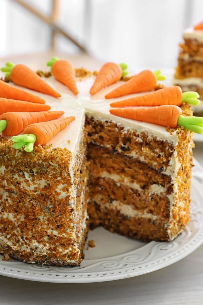 This is sliced carrot cake on a plate.