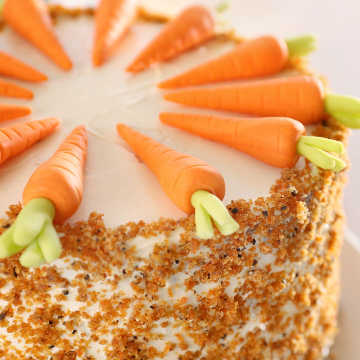This a closeup of carrot cake on a plate.